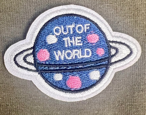 1.75" Out of the World Iron on patch.