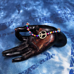 3" multi color/metal bead bracelet w/peace sign bead